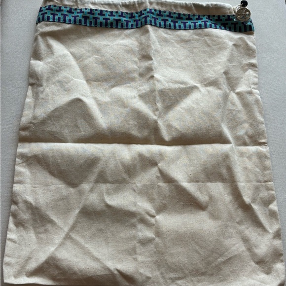 Tory Burch Handbags - Tory Burch Cream Canvas Pouch with Blue and Teal Geometric Trim 108
